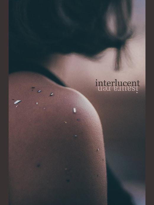 Cover of 'Interlucent' by Isaura Ren, a shoulder of a young women with a brush of confetti